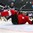 MINSK, BELARUS - MAY 16: Switzerland's Damien Brunner #96 goes crashing into the net while Finland's Tommi Kivisto #6 looks on during preliminary round action at the 2014 IIHF Ice Hockey World Championship. (Photo by Andre Ringuette/HHOF-IIHF Images)

